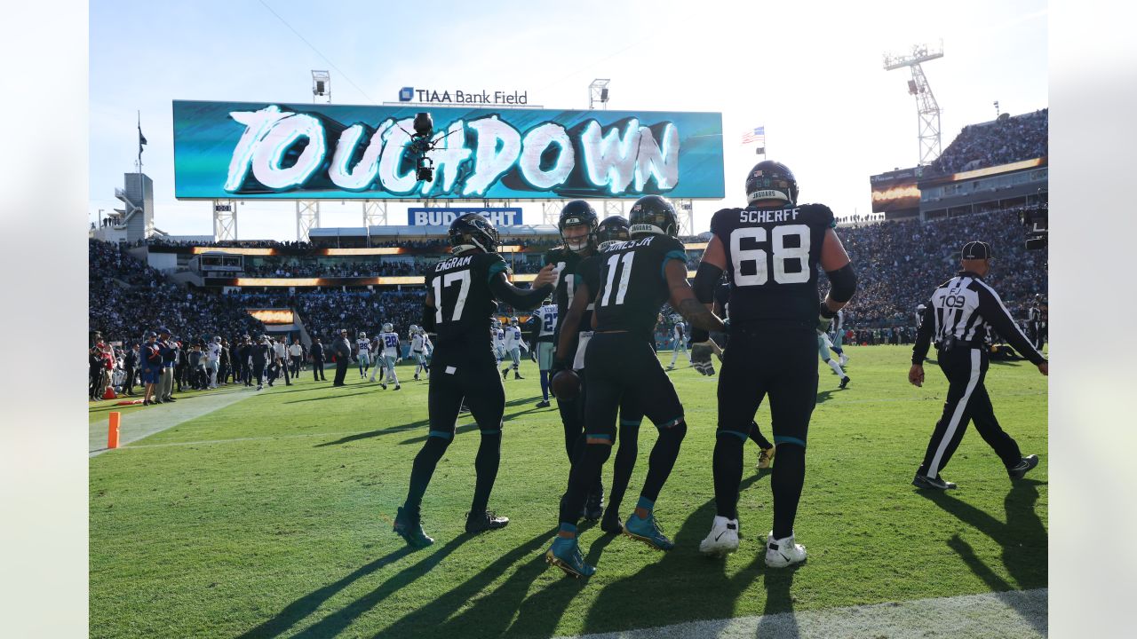 December 18, 2022: Jacksonville Jaguars running back TRAVIS ETIENNE JR. (1)  runs onto the field during the Jacksonville Jaguars vs Dallas Cowboys NFL  game at TIAA Bank Field Stadium in Jacksonville, Fl