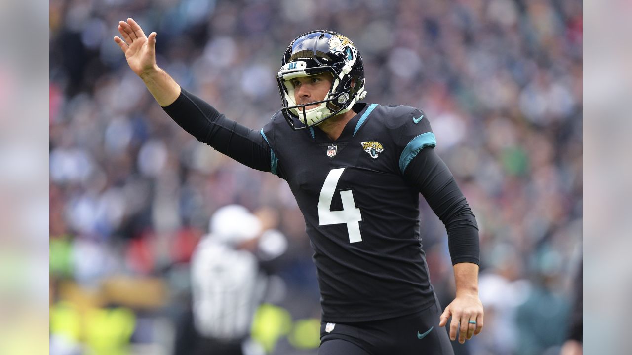 Jacksonville Jaguars place kicker Josh Lambo, right, and holder Logan Cooke  (9) watch the flight of the ball after Lambo kicked a field goal during the  second half of an NFL football