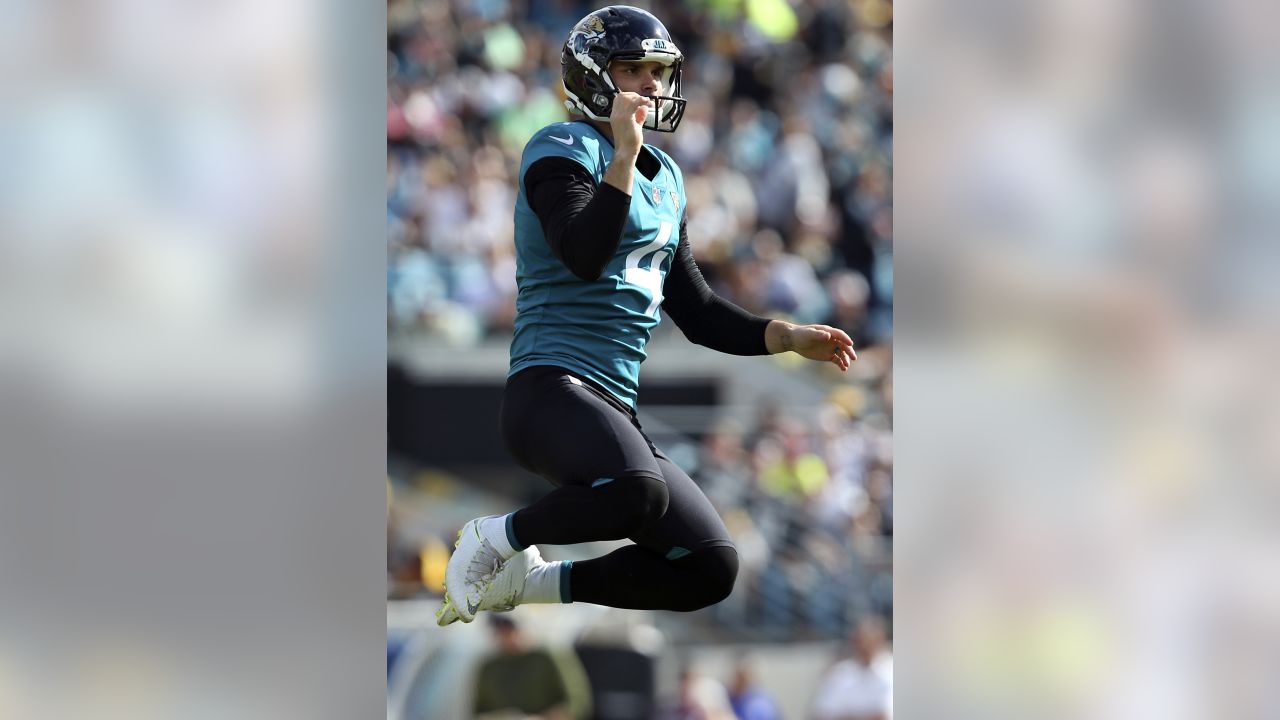 Jacksonville Jaguars place kicker Josh Lambo, right, and holder Logan Cooke  (9) watch the flight of the ball after Lambo kicked a field goal during the  second half of an NFL football