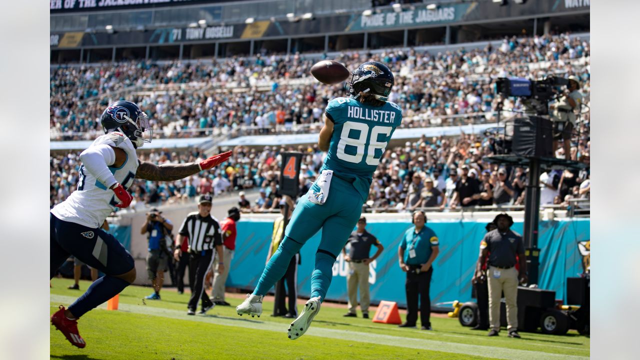 Jacksonville Jaguars wide receiver D.J. Chark (17) autographs his jersey on  the field after an NFL football game against the Tennessee Titans Sunday,  Sept. 23, 2018, in Jacksonville, Fla. The Titans won