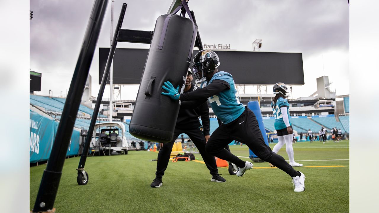 Jacksonville Jaguars linebacker Chad Muma (48) stretches during