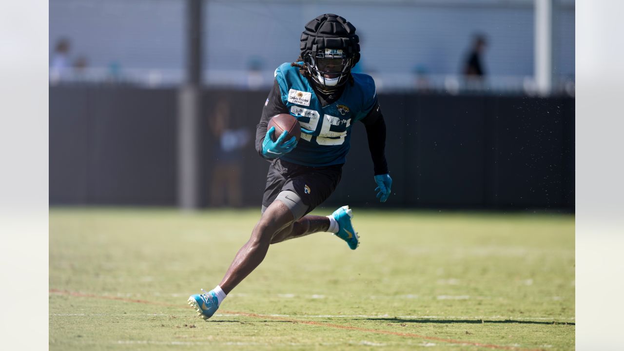 Jacksonville Jaguars offensive tackle Anton Harrison (76) puts on his helmet  before a drill during an NFL football practice, Monday, June 12, 2023, in  Jacksonville, Fla. (AP Photo/John Raoux Stock Photo - Alamy