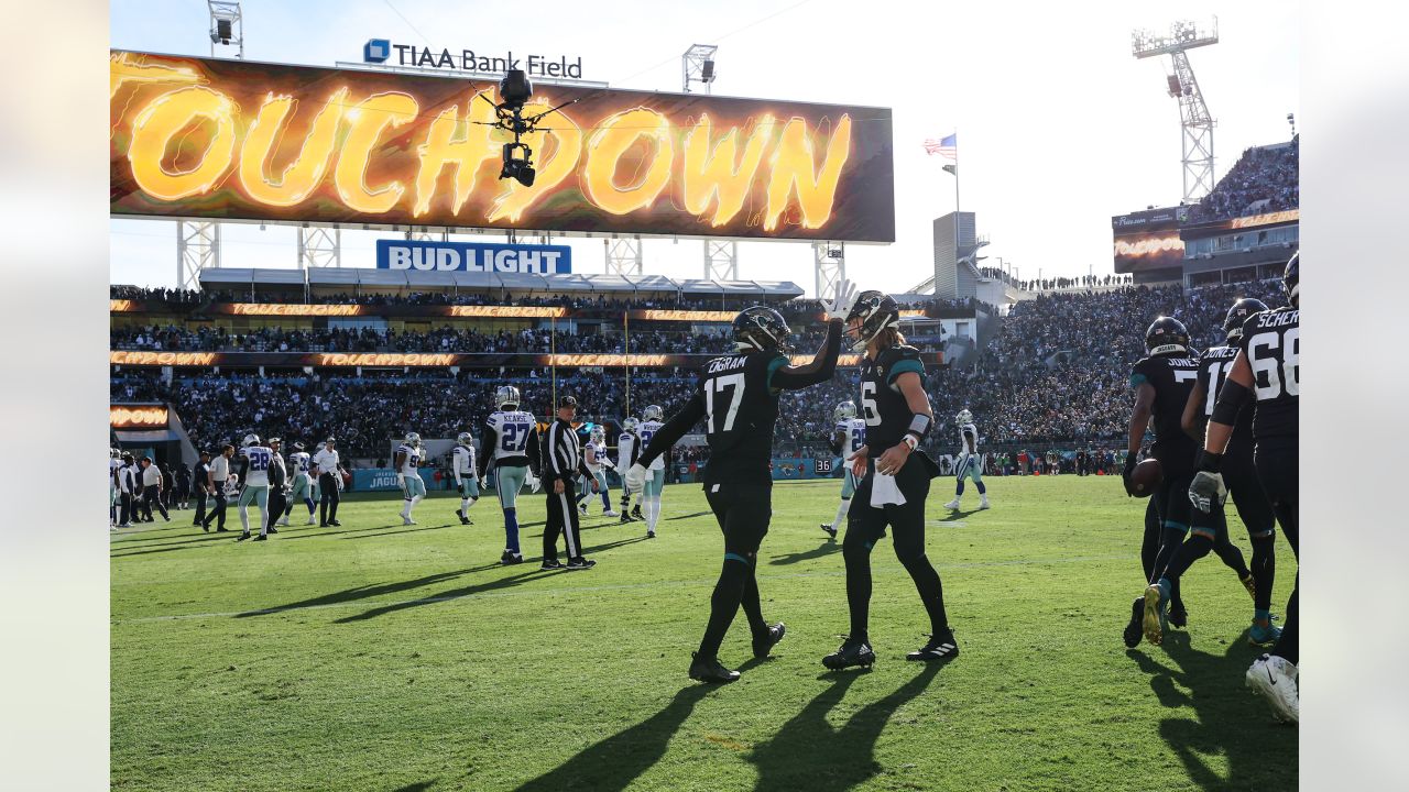 December 18, 2022: Jacksonville Jaguars running back TRAVIS ETIENNE JR. (1)  runs onto the field during the Jacksonville Jaguars vs Dallas Cowboys NFL  game at TIAA Bank Field Stadium in Jacksonville, Fl