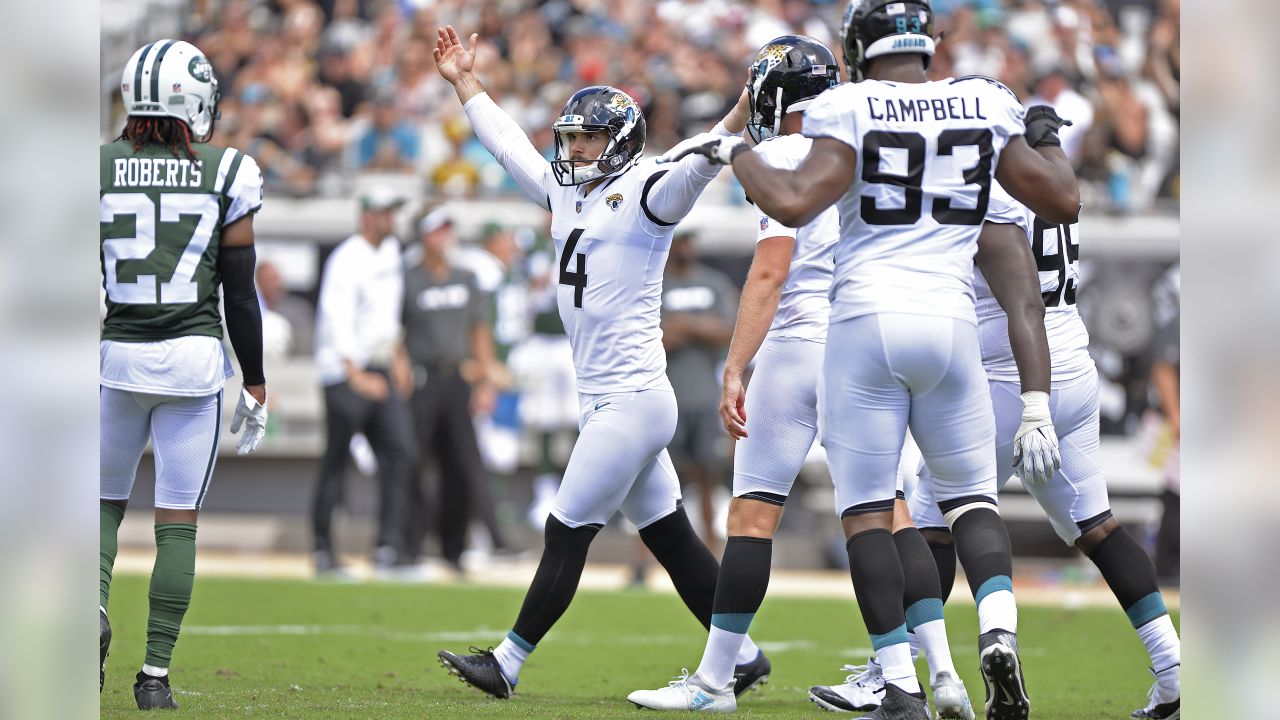 Jacksonville Jaguars kicker Josh Lambo, right, kicks a field goal in the  first half of an NFL football game against the Cincinnati Bengals, Sunday,  Oct. 20, 2019, in Cincinnati. (AP Photo/Frank Victores