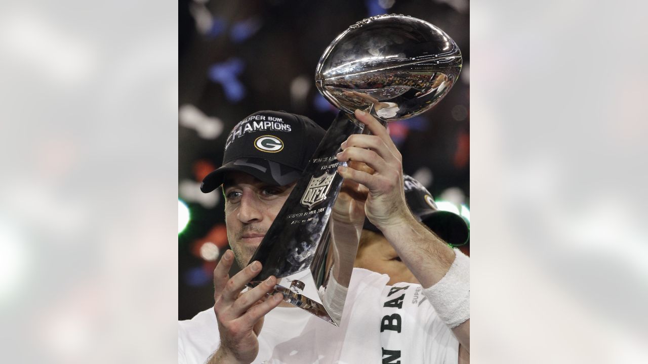 Aaron Rodgers holding Super Bowl trophy