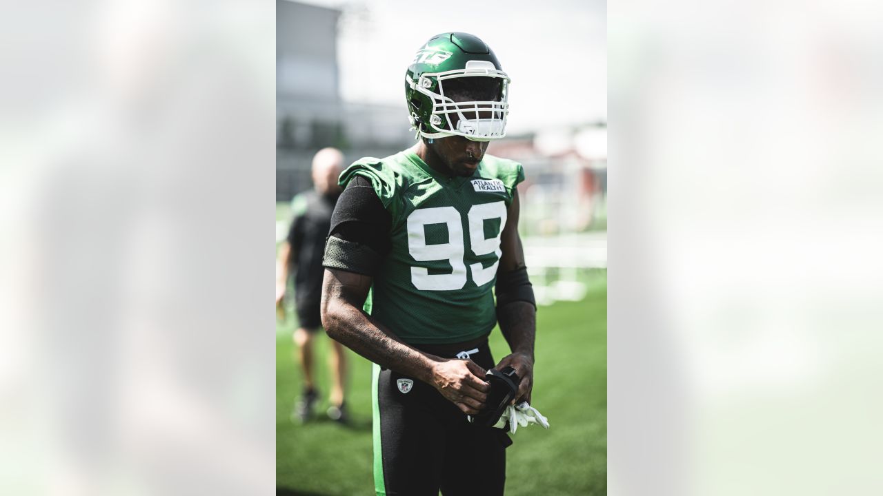 New York Jets linebacker Jermaine Johnson (52) warms up before playing  against the Buffalo Bills in