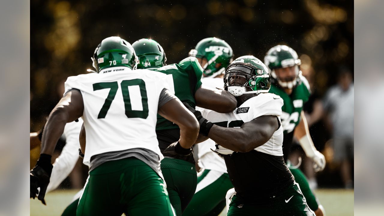 Wrestlers grapple with football at Jets camp