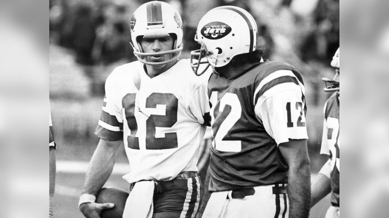 New York Jets quarterback Joe Namath, right, and Buffalo Bills quarterback Joe Ferguson, have each other's numbers as they walk off the field at New York's Shea Stadium in New York after the Bills squeaked through with the 24-23 victory, Nov. 2, 1975. (AP Photo/Ray Stubblebine)