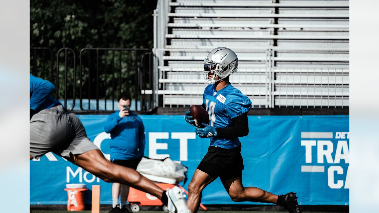 Detroit Lions wide receiver Amon-Ra St. Brown (14) runs a route