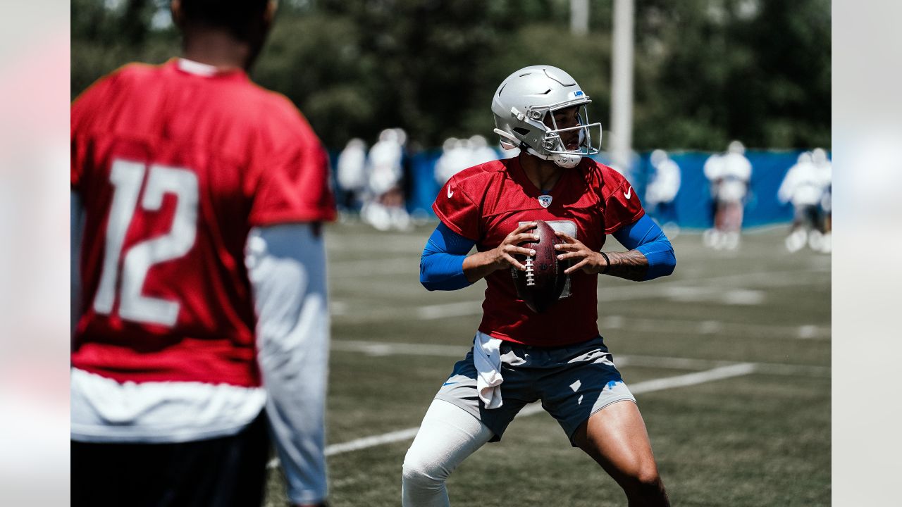 Detroit Lions quarterback Adrian Martinez (18) keeps the ball