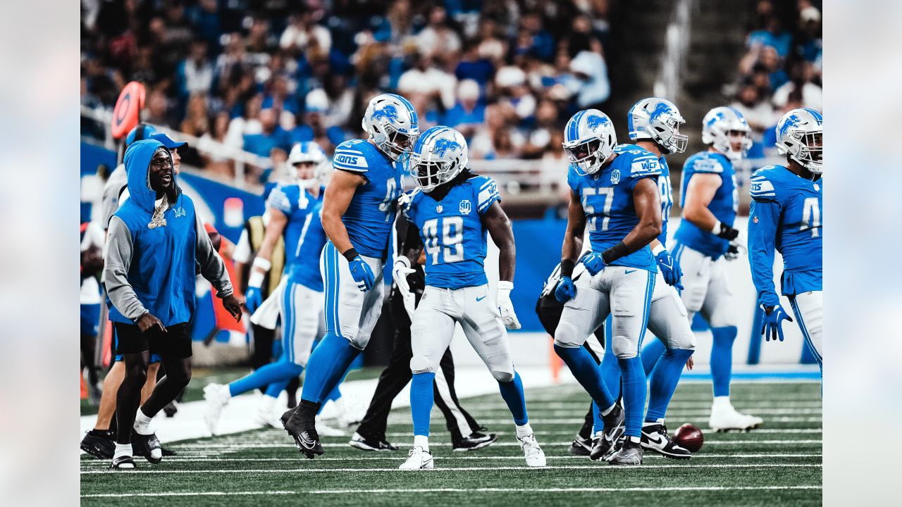 Malcolm Rodriguez and Jack Campbell of the Detroit Lions tackle