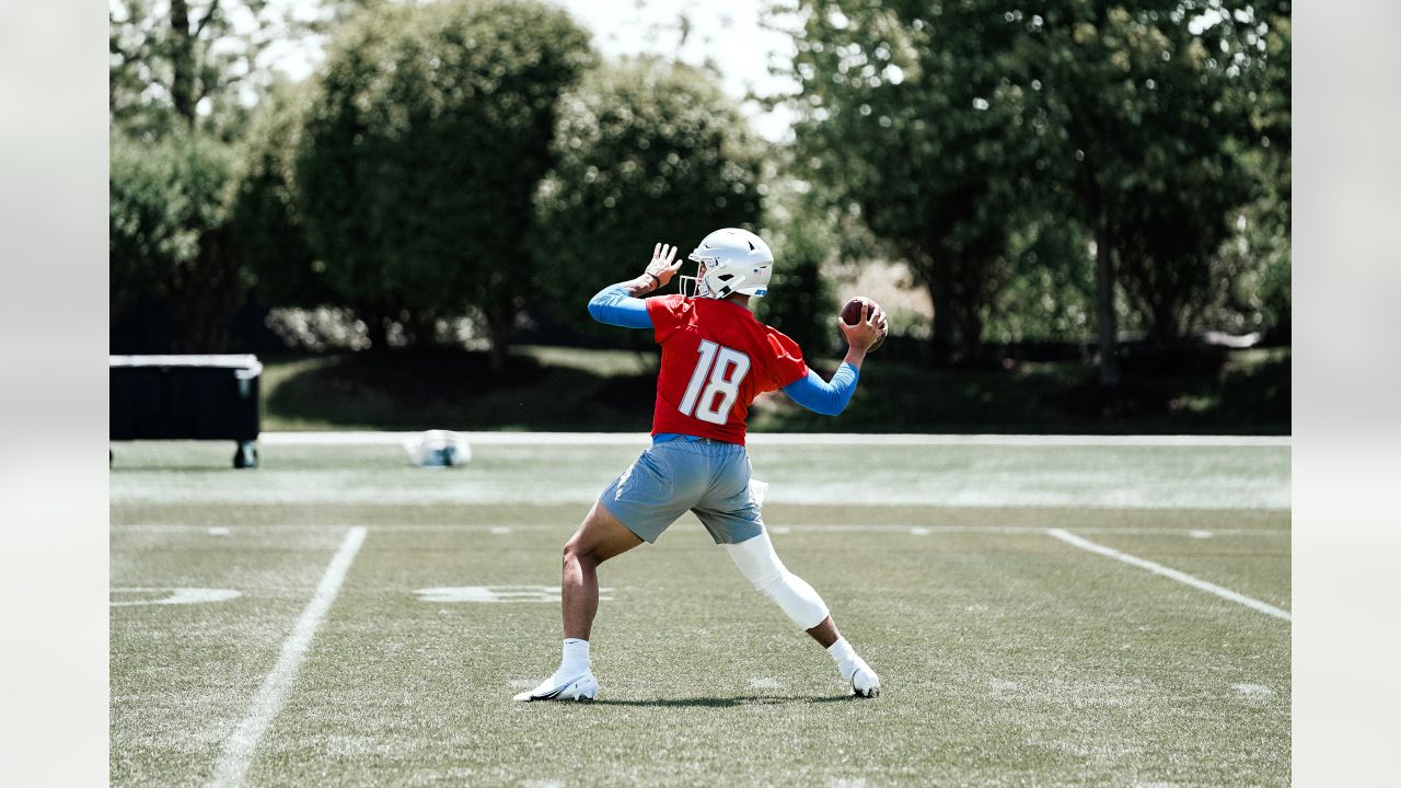 Detroit Lions quarterback Adrian Martinez (18) keeps the ball