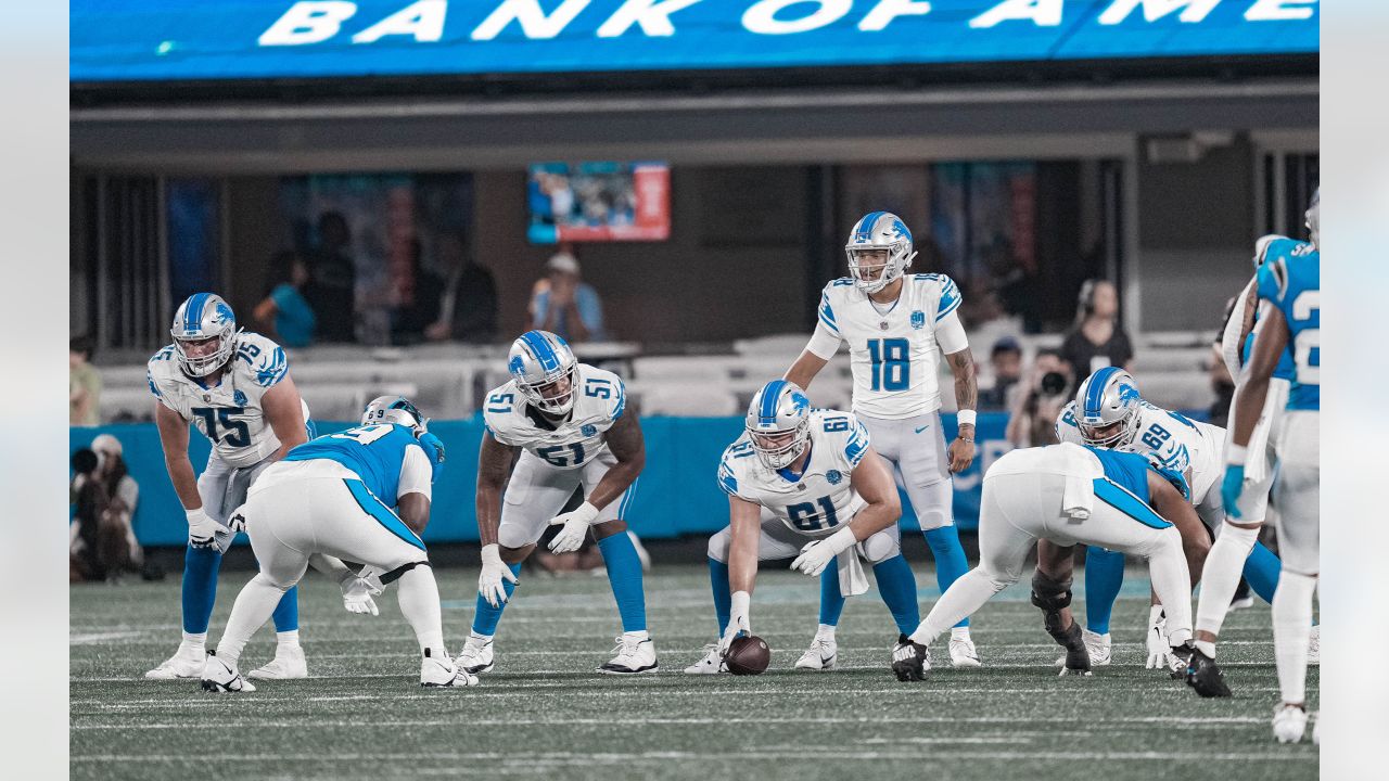 Detroit Lions quarterback Adrian Martinez (18) keeps the ball during the  second half of an NFL