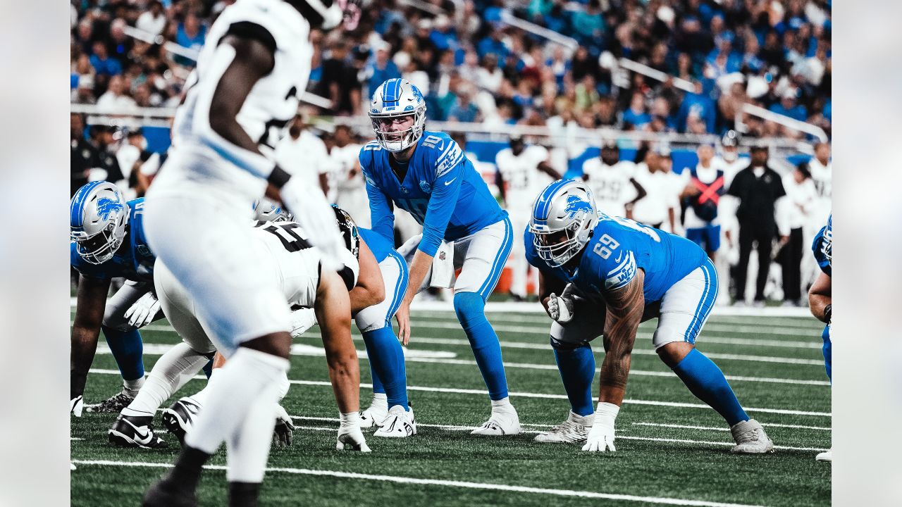 Malcolm Rodriguez and Jack Campbell of the Detroit Lions tackle