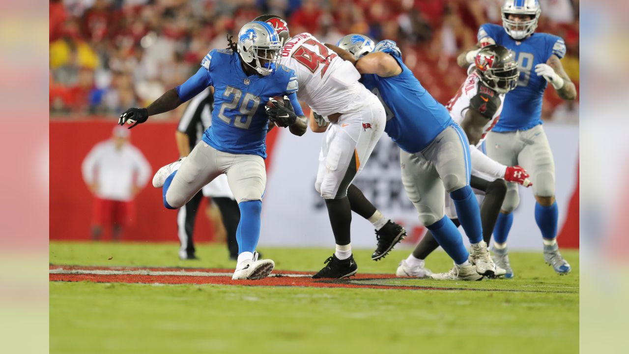 Tampa Bay Buccaneers running back Cadillac Williams (24) finds an opening  in the Detroit Lion defense during an NFL football game between the  Buccaneers and the Lions Sunday in Tampa, Fla, December