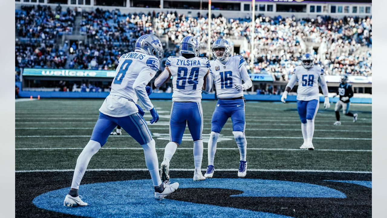 Charlotte, NC, USA. 24th Dec, 2022. Detroit Lions wide receiver Jameson  Williams (9) runs to tight end Shane Zylstra (84) after the touchdown  during the first half of the NFL matchup against