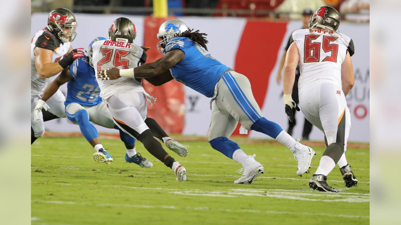 Tampa Bay Buccaneers running back Cadillac Williams (24) finds an opening  in the Detroit Lion defense during an NFL football game between the  Buccaneers and the Lions Sunday in Tampa, Fla, December