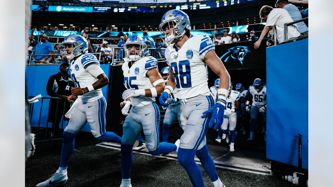 Detroit Lions quarterback Adrian Martinez (18) keeps the ball during the  second half of an NFL