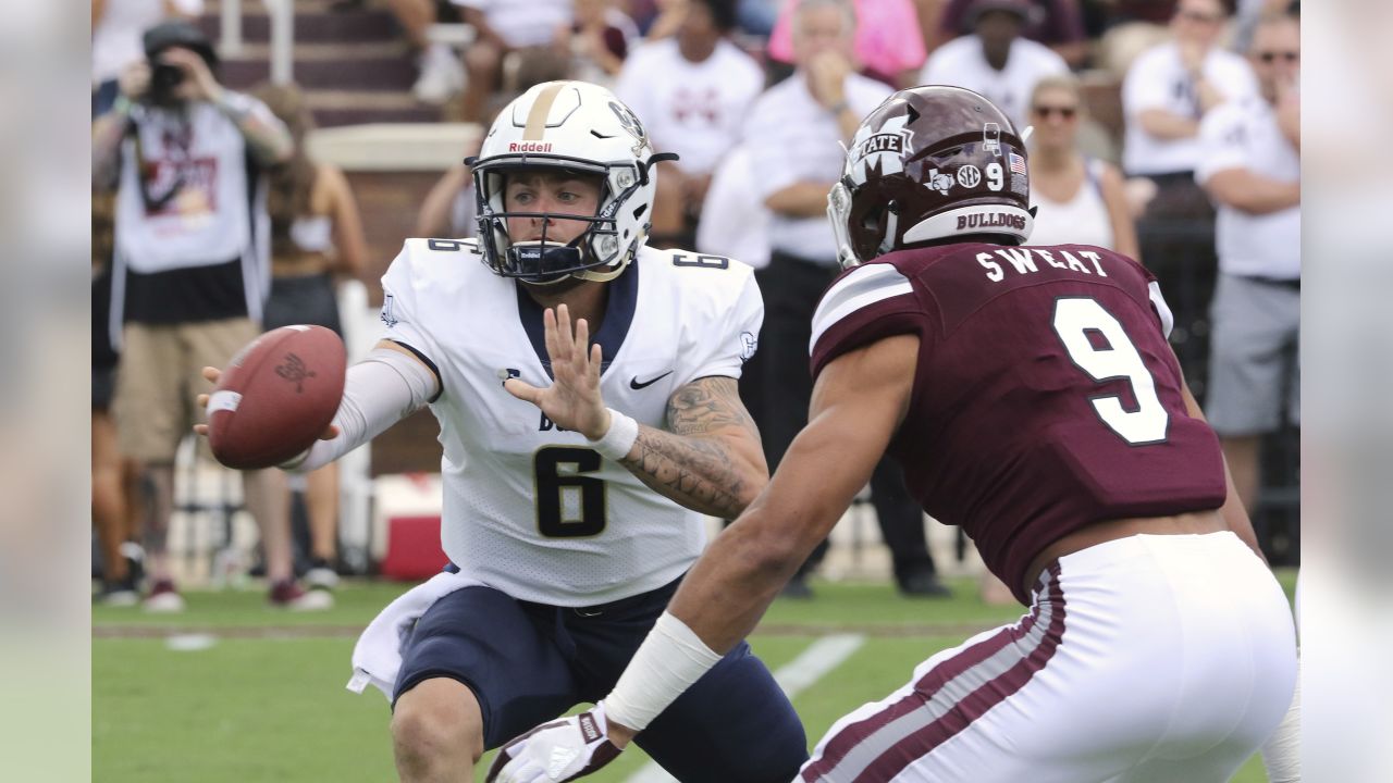Charleston Southern quarterback Shane Bucenell (6) pitches the ball as Mississippi State defender Montez Sweat (9) puts pressure on him during the first half of an NCAA college football game in Starkville, Miss., Saturday, Sept. 2, 2017. (AP Photo/Jim Lytle)