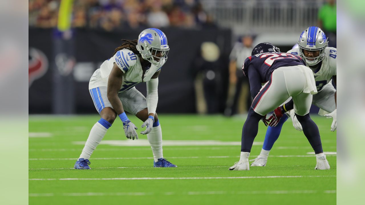 Detroit Lions defensive back Dee Virgin (30) steps on the line for