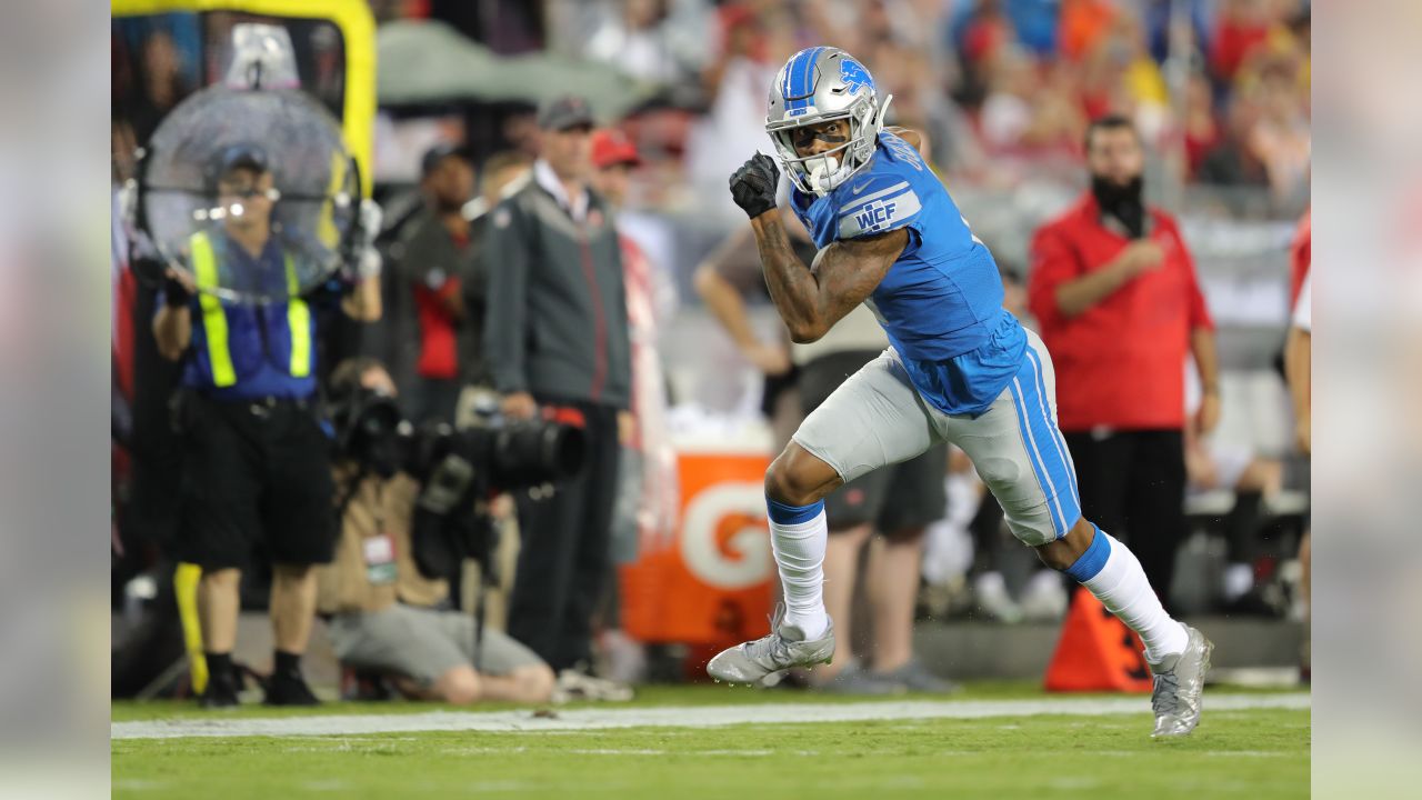 Tampa Bay Buccaneers running back Cadillac Williams (24) finds an opening  in the Detroit Lion defense during an NFL football game between the  Buccaneers and the Lions Sunday in Tampa, Fla, December