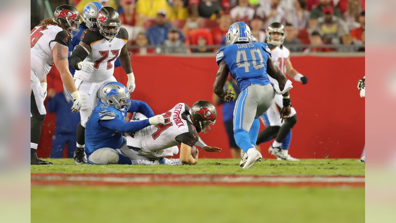 Tampa Bay Buccaneers running back Cadillac Williams (24) finds an opening  in the Detroit Lion defense during an NFL football game between the  Buccaneers and the Lions Sunday in Tampa, Fla, December