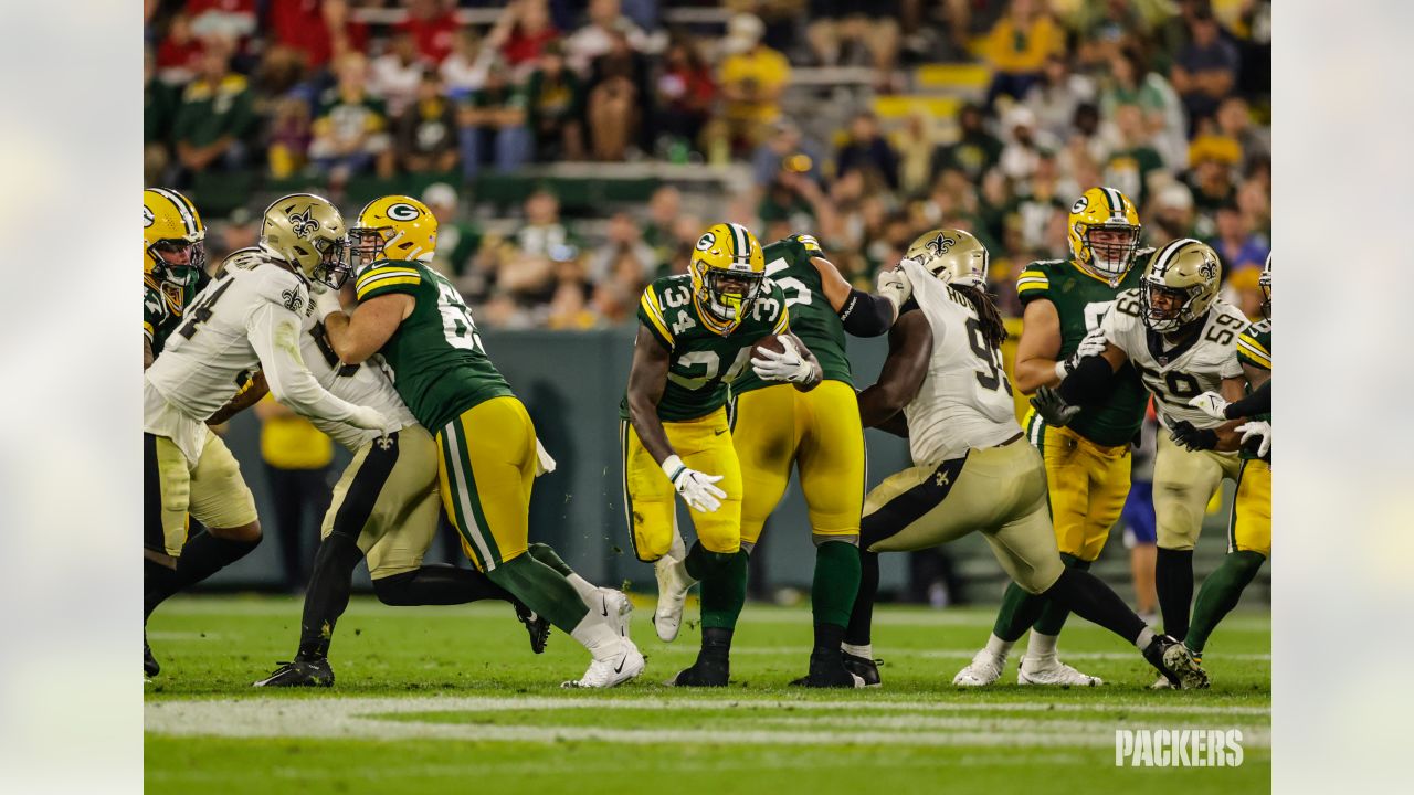 Green Bay Packers quarterback Danny Etling (19) runs for a touchdown during  an NFL Preseason game against the New Orleans Saints Friday, Aug. 19, 2022,  in Green Bay, Wis. (AP Photo/Jeffrey Phelps