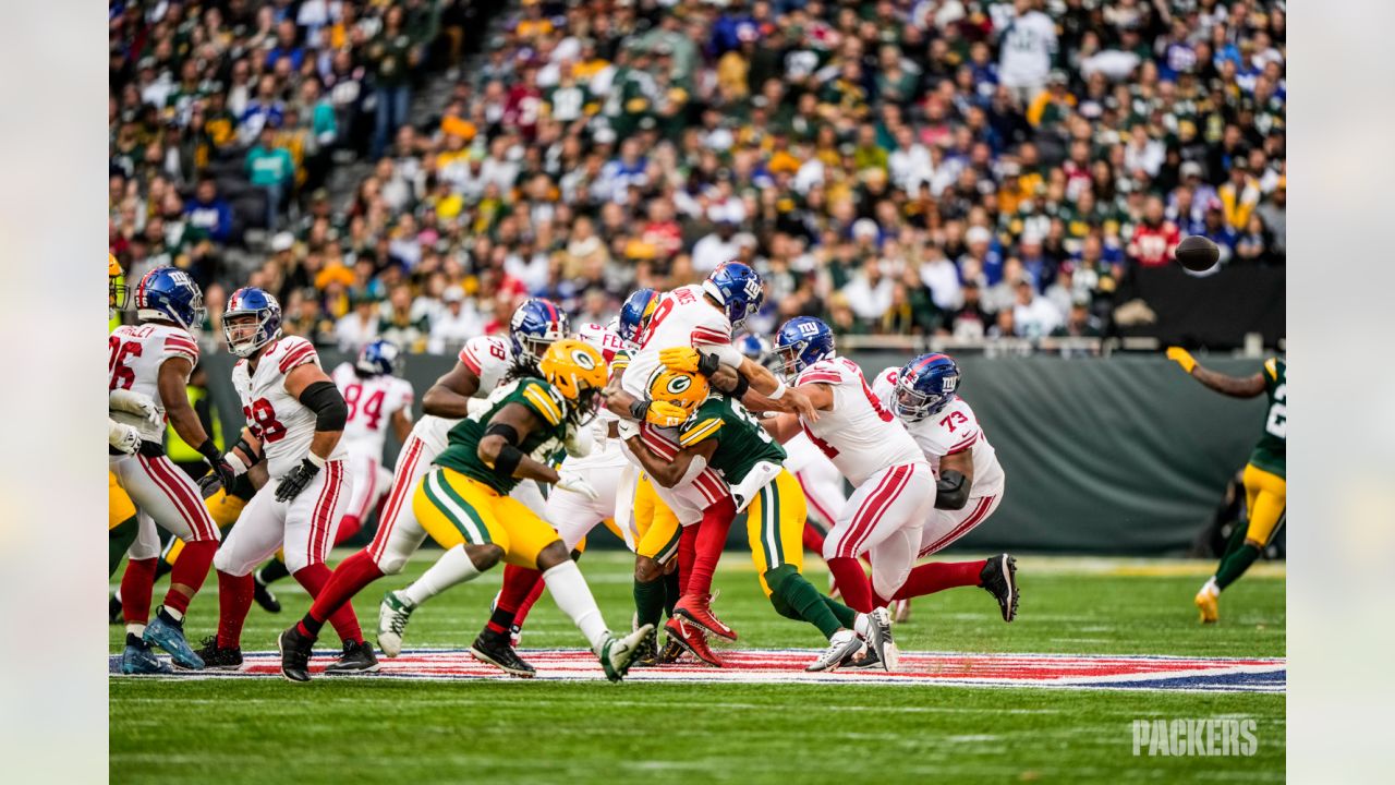 Green Bay Packers players form a huddle as they warm-up before an NFL game  between the New York Giants and the Green Bay Packers at the Tottenham  Hotspur stadium in London, Sunday