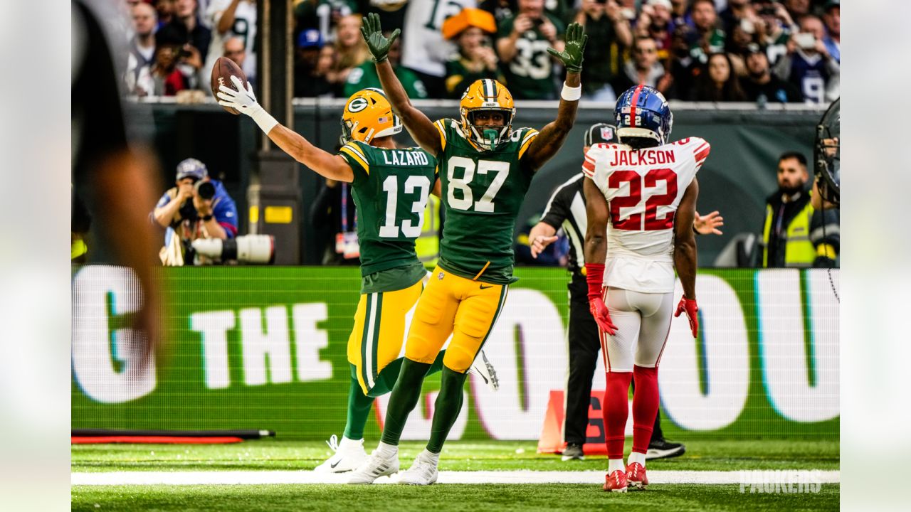 Green Bay Packers players form a huddle as they warm-up before an NFL game  between the New York Giants and the Green Bay Packers at the Tottenham  Hotspur stadium in London, Sunday