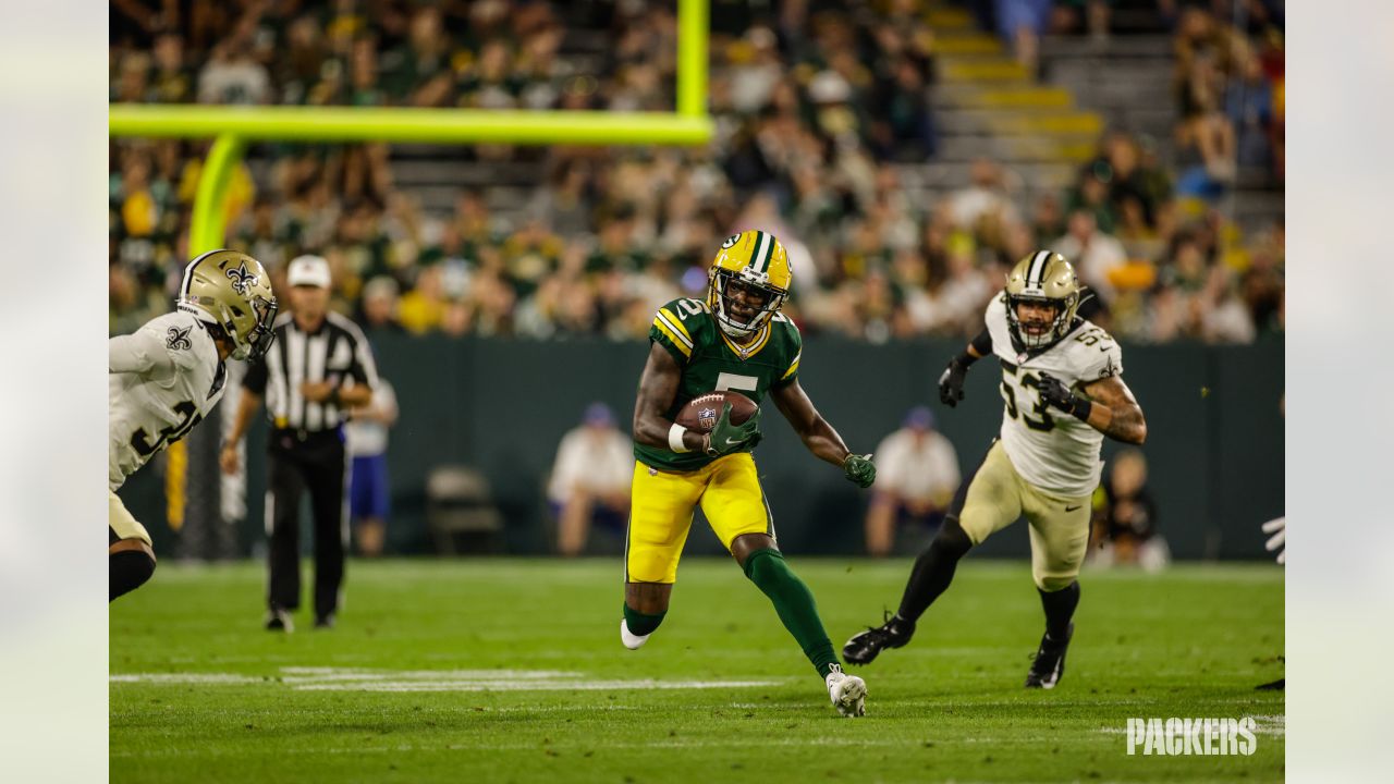 Green Bay Packers quarterback Danny Etling (19) runs for a touchdown during  an NFL Preseason game against the New Orleans Saints Friday, Aug. 19, 2022,  in Green Bay, Wis. (AP Photo/Jeffrey Phelps