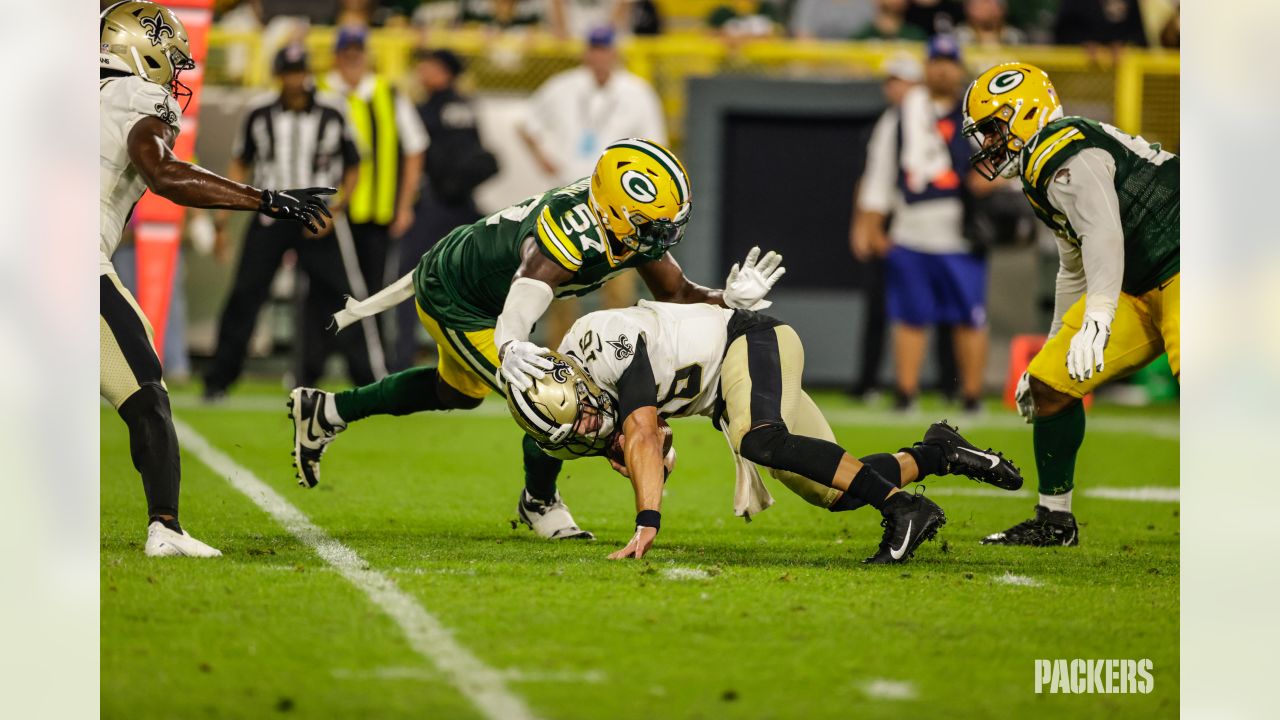 Green Bay Packers quarterback Danny Etling (19) runs for a touchdown during  an NFL Preseason game against the New Orleans Saints Friday, Aug. 19, 2022,  in Green Bay, Wis. (AP Photo/Jeffrey Phelps