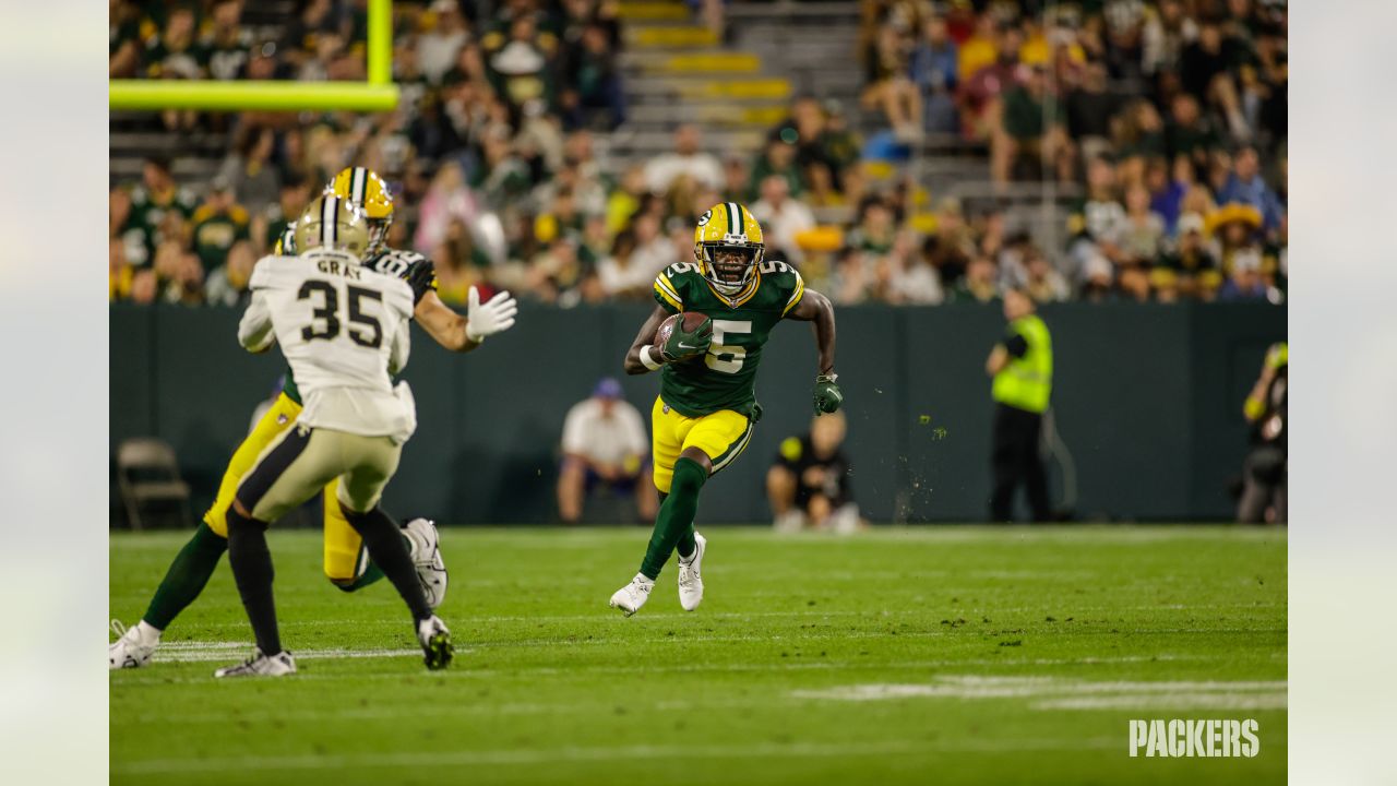 Green Bay Packers quarterback Danny Etling (19) runs for a touchdown during  an NFL Preseason game against the New Orleans Saints Friday, Aug. 19, 2022,  in Green Bay, Wis. (AP Photo/Jeffrey Phelps