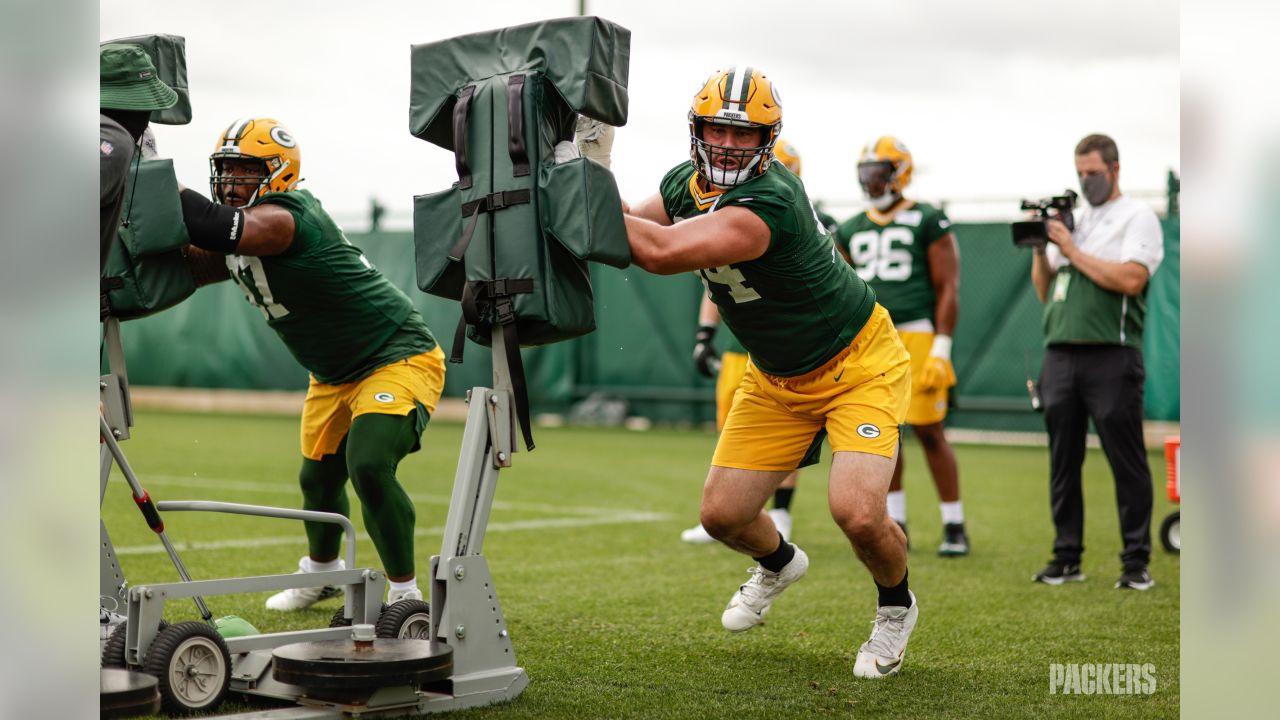 Green Bay Packers' Za'Darius Smith (55) and Kingsley Keke ride