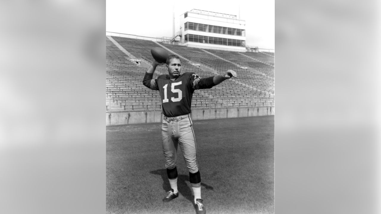 Green Bay Packers quarterback Bart Starr is led away from the team?s  clubhouse by his son, three-year-old Bret, following a training camp  session, July 19, 1967 in Green Bay, Wis. Bret often