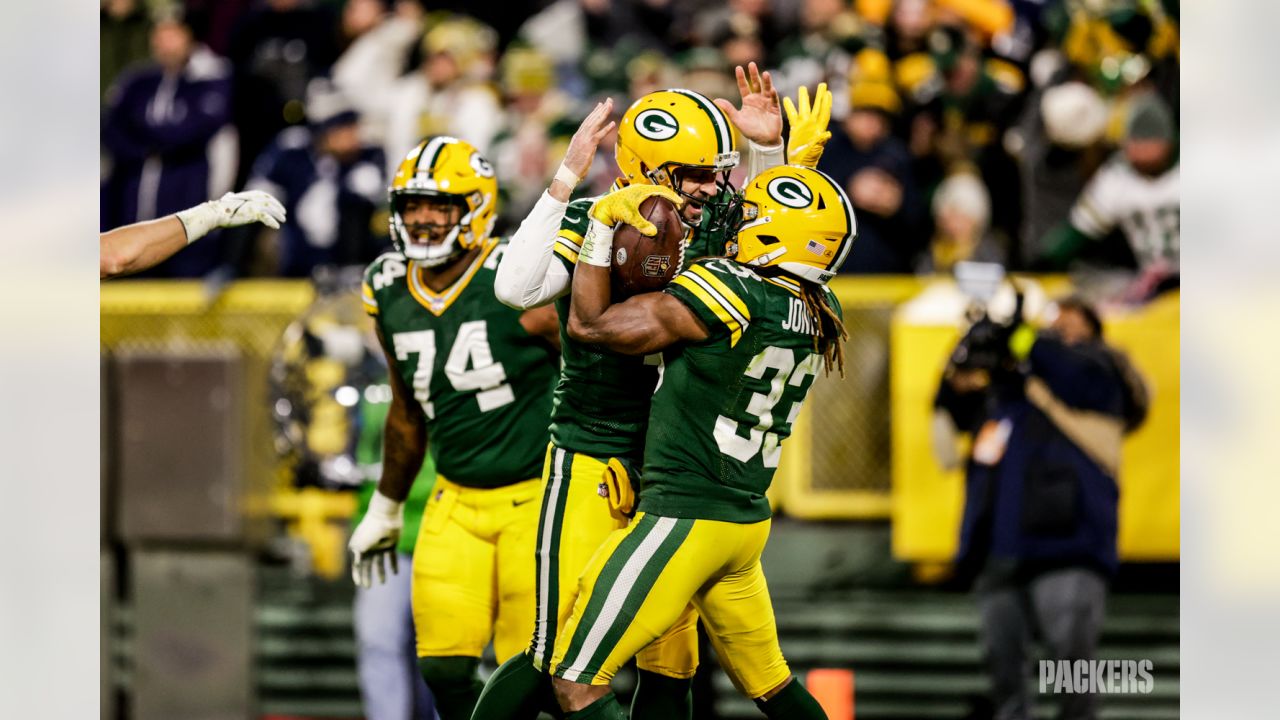 MIAMI GARDENS, FL - DECEMBER 25: Green Bay Packers wide receiver Christian  Watson (9) trip trying to get in the end zone in the first half during the  game between the Green