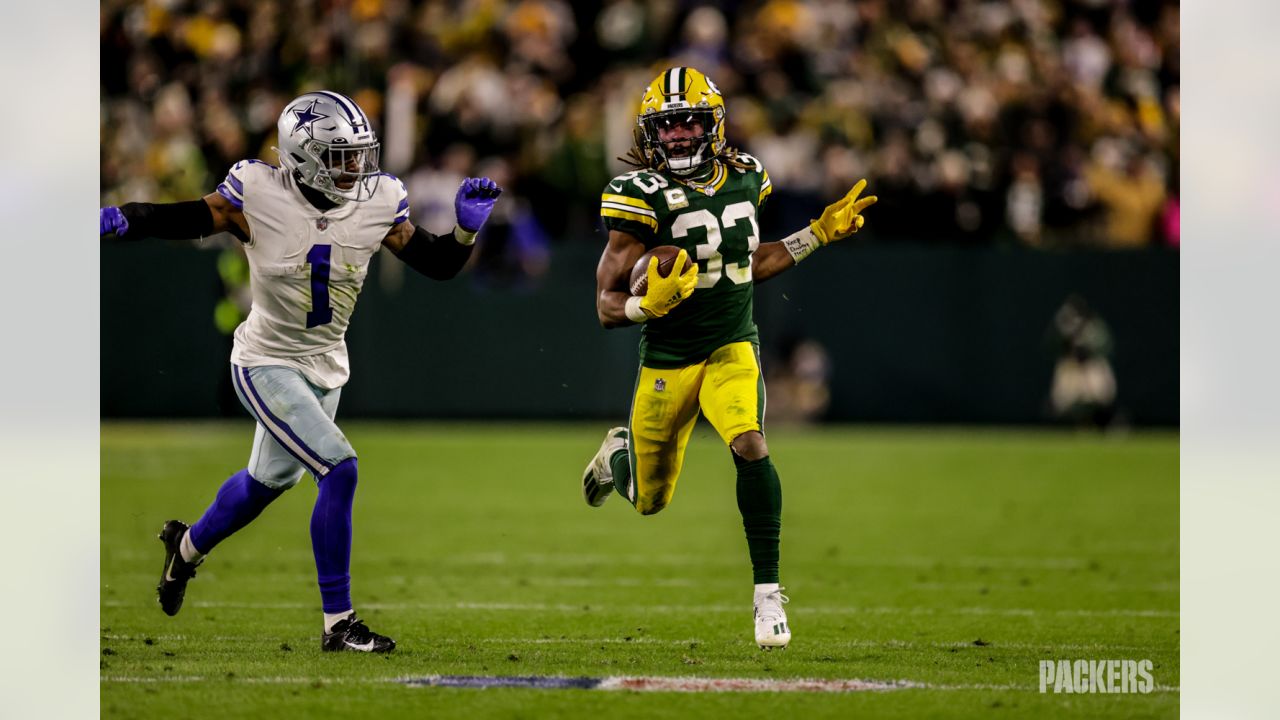 Green Bay Packers safety Rudy Ford (20) celebrates intercepting a Dallas  Cowboys quarterback Dak Prescott pass during the first half of an NFL  football game Sunday, Nov. 13, 2022, in Green Bay