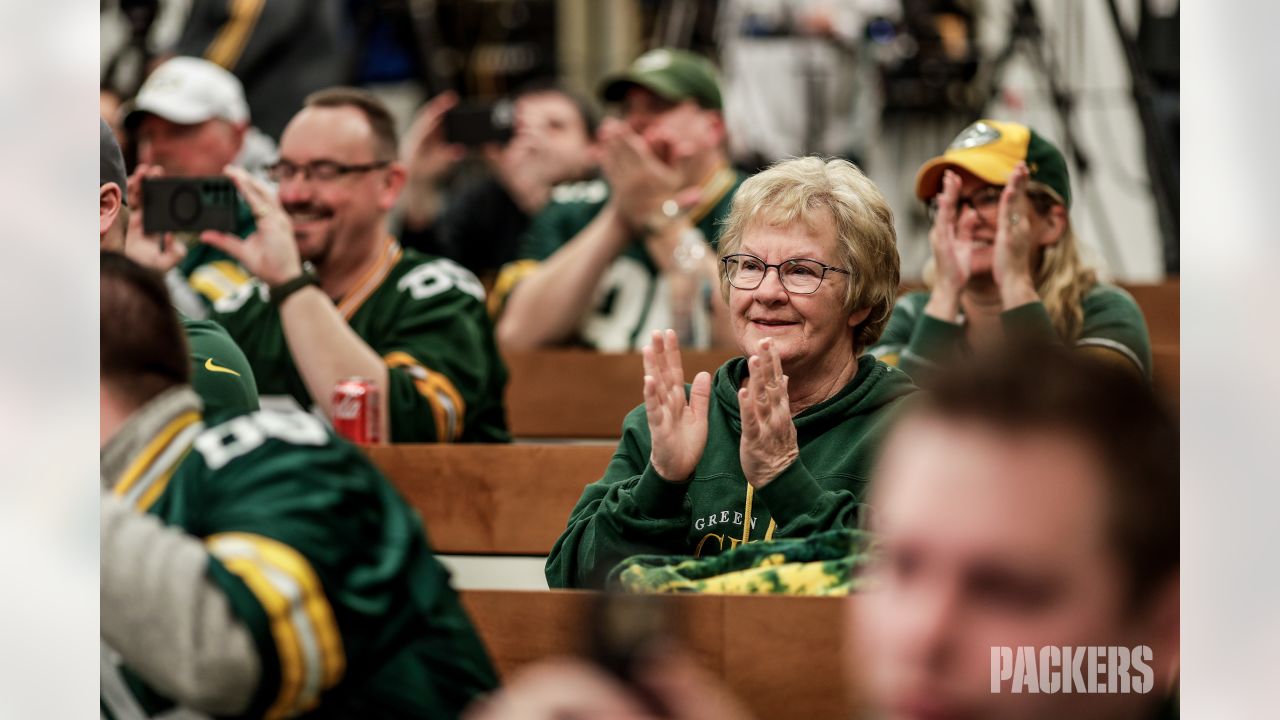 A Green Bay Packers fan shows up with the traditional Green Bay Cheese Hat  as he and a fellow Green Bay fan watch during first quarter action of the  Philadelphia Eagles-Green Bay