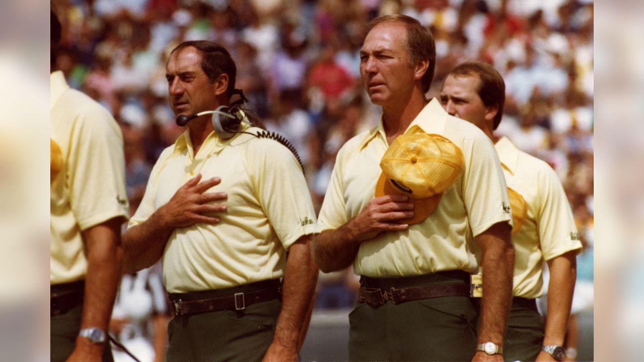 Green Bay Packers quarterback Bart Starr is led away from the team?s  clubhouse by his son, three-year-old Bret, following a training camp  session, July 19, 1967 in Green Bay, Wis. Bret often