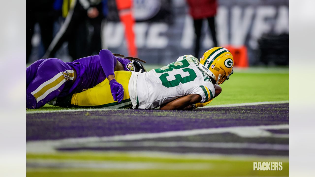 BALTIMORE, MD - DECEMBER 19: Packers running back A.J. Dillon (28) runs the  ball during the Green Bay Packers versus Baltimore Ravens NFL game at M&T  Bank Stadium on December 19, 2021