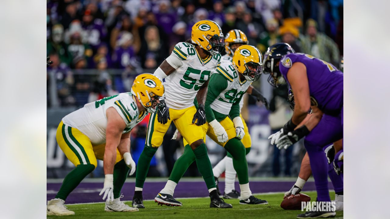 BALTIMORE, MD - DECEMBER 19: Packers running back A.J. Dillon (28) runs the  ball during the Green Bay Packers versus Baltimore Ravens NFL game at M&T  Bank Stadium on December 19, 2021