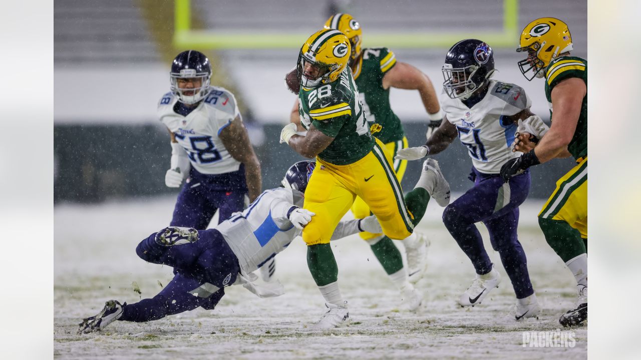 AJ Dillon of the Green Bay Packers warms up before the game