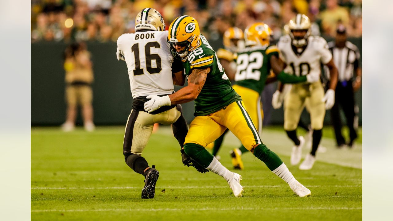 Green Bay Packers quarterback Danny Etling (19) runs for a touchdown during  an NFL Preseason game against the New Orleans Saints Friday, Aug. 19, 2022,  in Green Bay, Wis. (AP Photo/Jeffrey Phelps