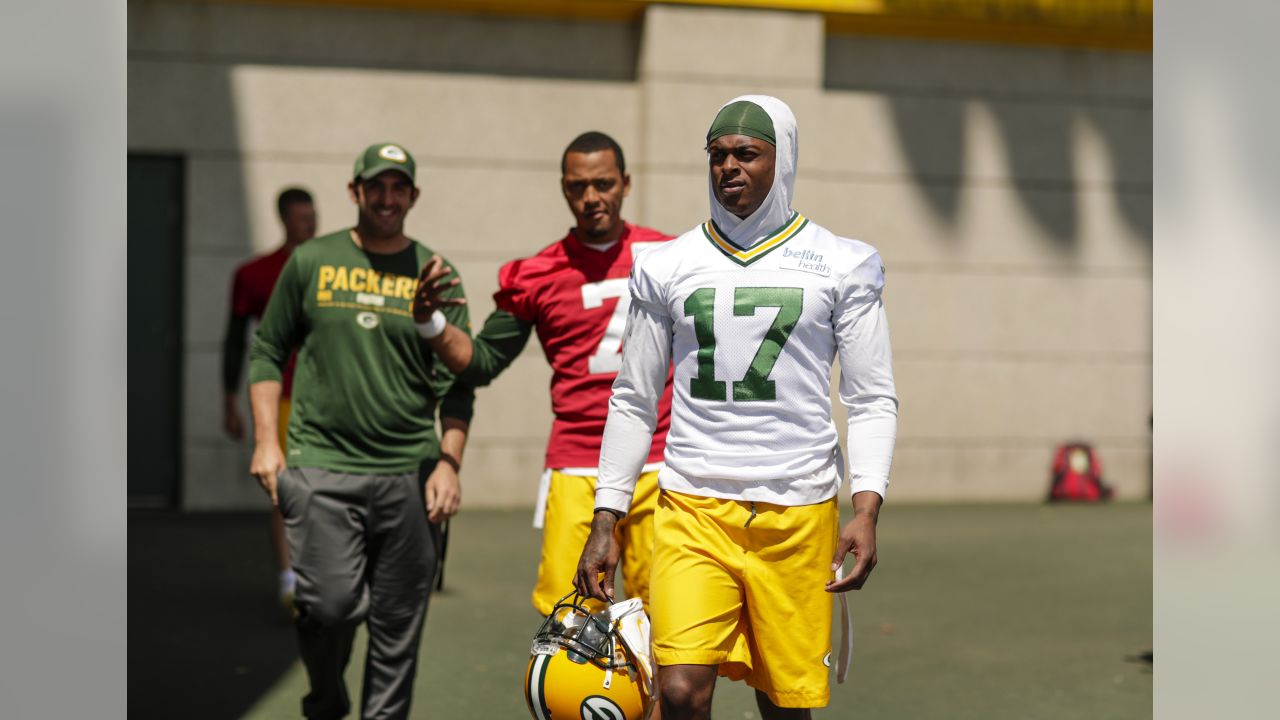 Green Bay Packers Jason Spitz (72) and teammates react to a hard