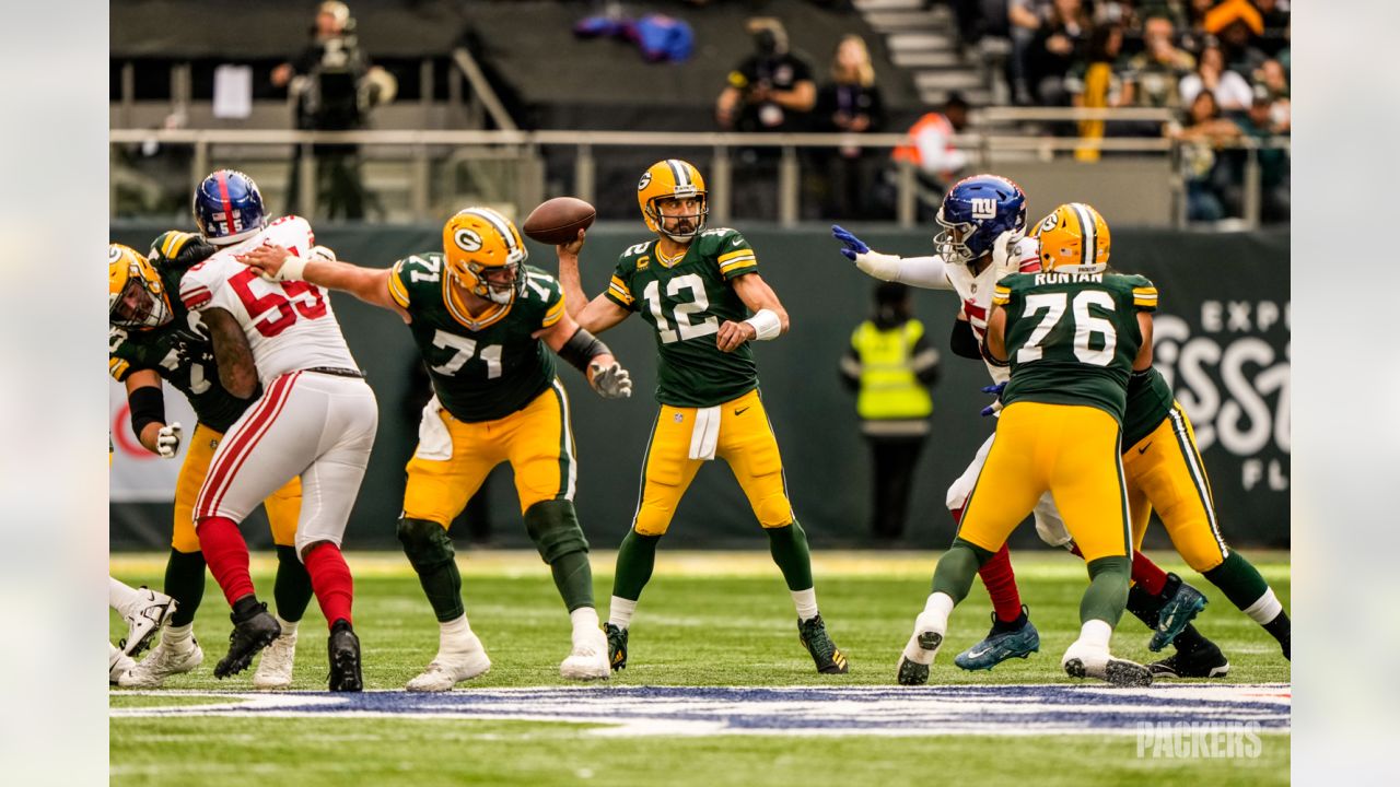 Green Bay Packers players form a huddle as they warm-up before an NFL game  between the New York Giants and the Green Bay Packers at the Tottenham  Hotspur stadium in London, Sunday