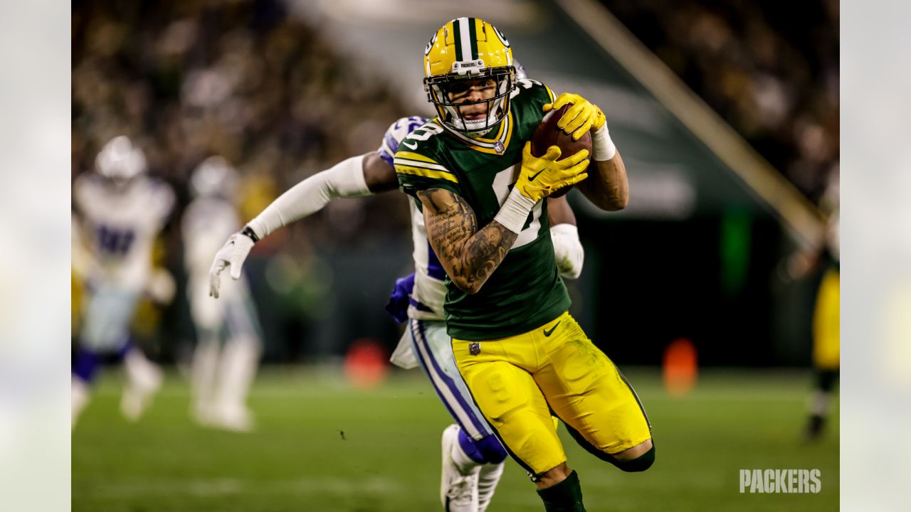 Christian Watson showing off his backflip to Packers fans in training