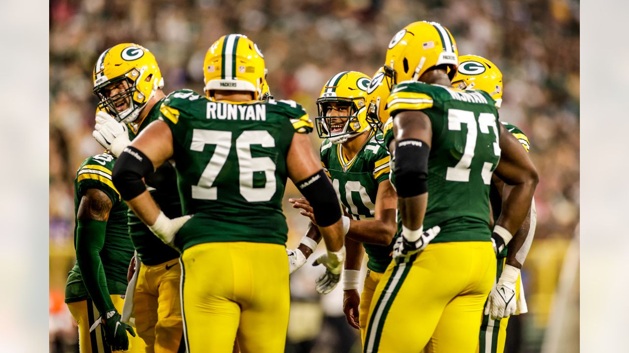 Green Bay Packers quarterback Danny Etling (19) runs for a