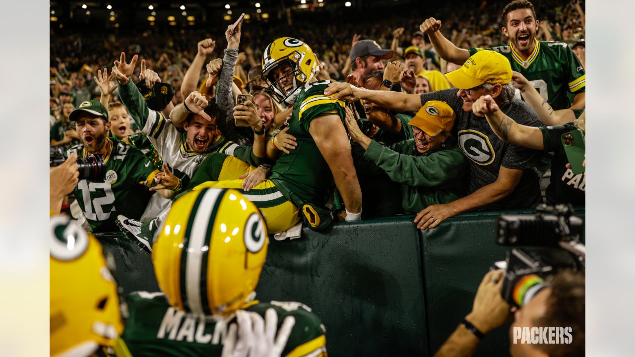 Green Bay Packers quarterback Danny Etling (19) runs for a touchdown during  an NFL Preseason game against the New Orleans Saints Friday, Aug. 19, 2022,  in Green Bay, Wis. (AP Photo/Jeffrey Phelps