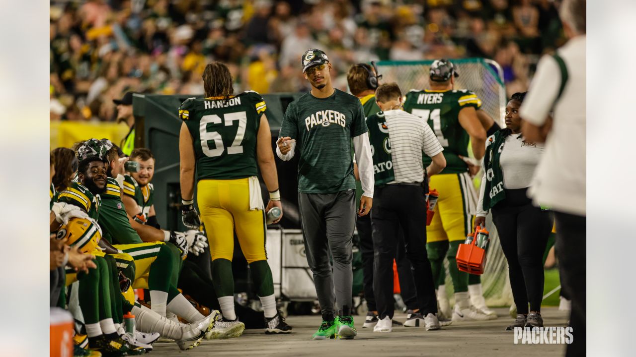 Green Bay Packers quarterback Danny Etling (19) runs for a touchdown during  an NFL Preseason game against the New Orleans Saints Friday, Aug. 19, 2022,  in Green Bay, Wis. (AP Photo/Jeffrey Phelps