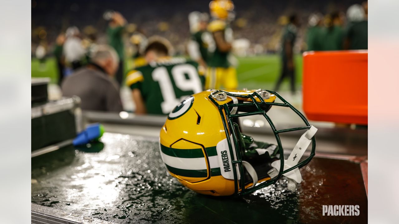 Green Bay Packers quarterback Danny Etling (19) runs for a touchdown during  an NFL Preseason game against the New Orleans Saints Friday, Aug. 19, 2022,  in Green Bay, Wis. (AP Photo/Jeffrey Phelps