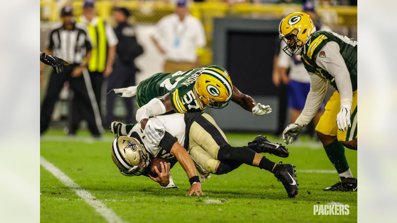 Green Bay Packers quarterback Danny Etling (19) runs for a touchdown during  an NFL Preseason game against the New Orleans Saints Friday, Aug. 19, 2022,  in Green Bay, Wis. (AP Photo/Jeffrey Phelps